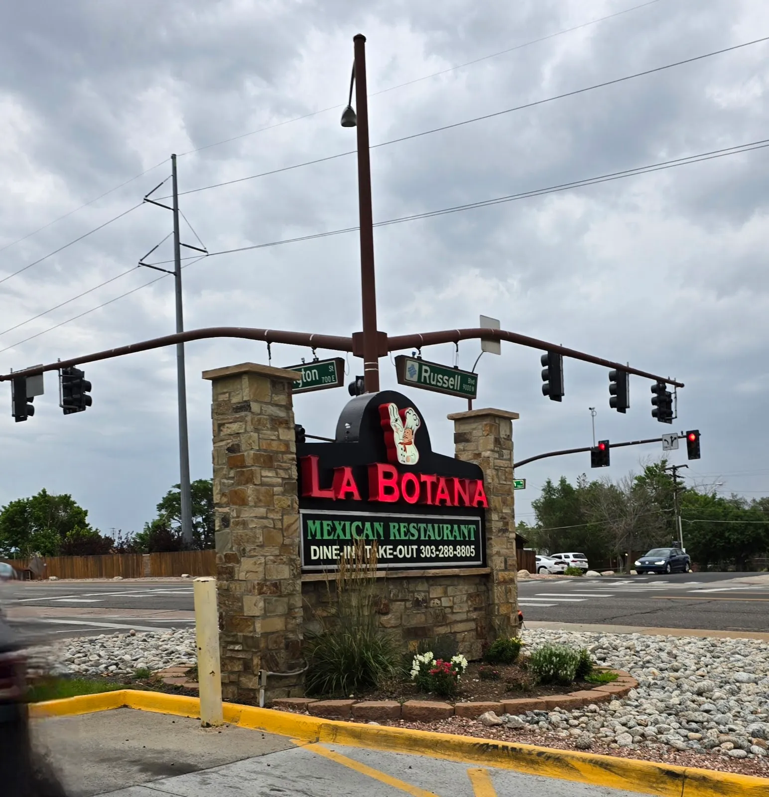 The La Botana monument sign topped with a rooster, reading La Botana Mexican Restaurant, Dine-In Take-Out, 303-288-8805